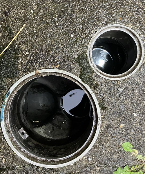 屋外の排水桝を高圧洗浄して詰まり除去