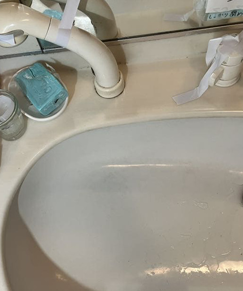 シャワーホースから漏水した洗面蛇口